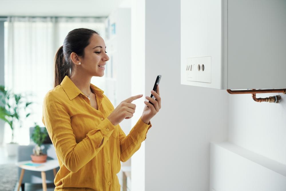 Woman contacting Heating Engineer
